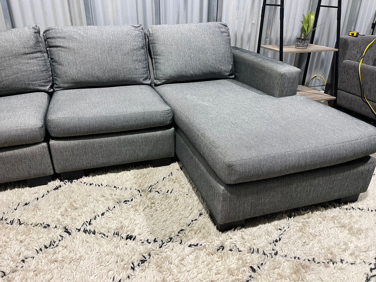Excellent Condition
- NZ Made Stone Gray Colour - 3 Seater L Shape Sofa